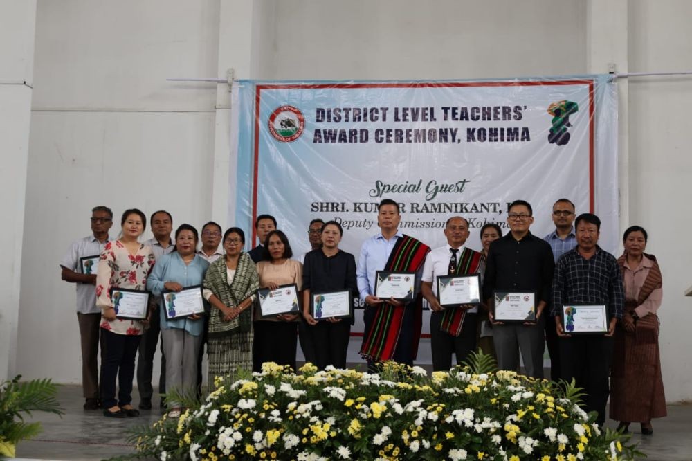Recipients of Kohima District Teacher Awards and Best Performing School Heads along with DC Kumar Ramnikant at Razhükhrie Government Higher Secondary School, Kohima on September 3. (Morung Photo)